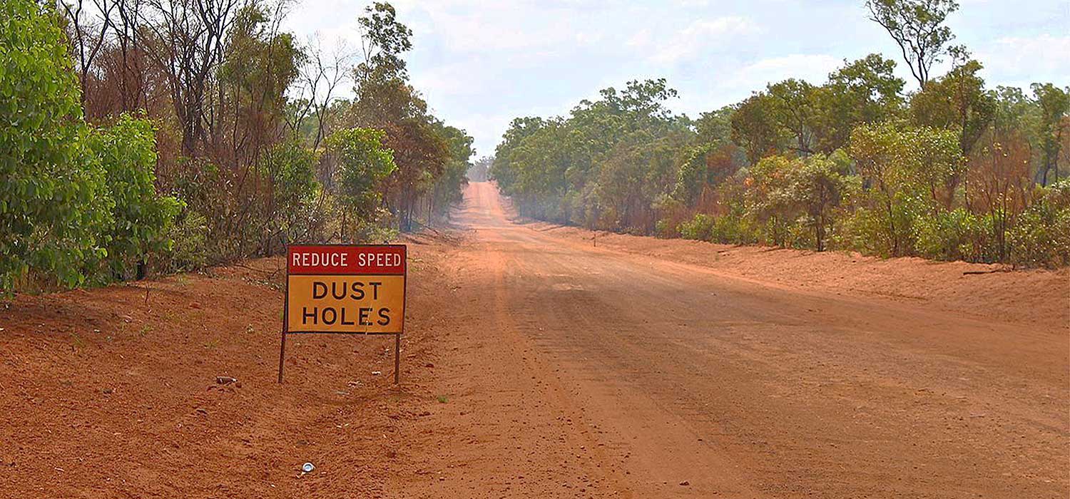 dust holes sign on the Peninsula development road