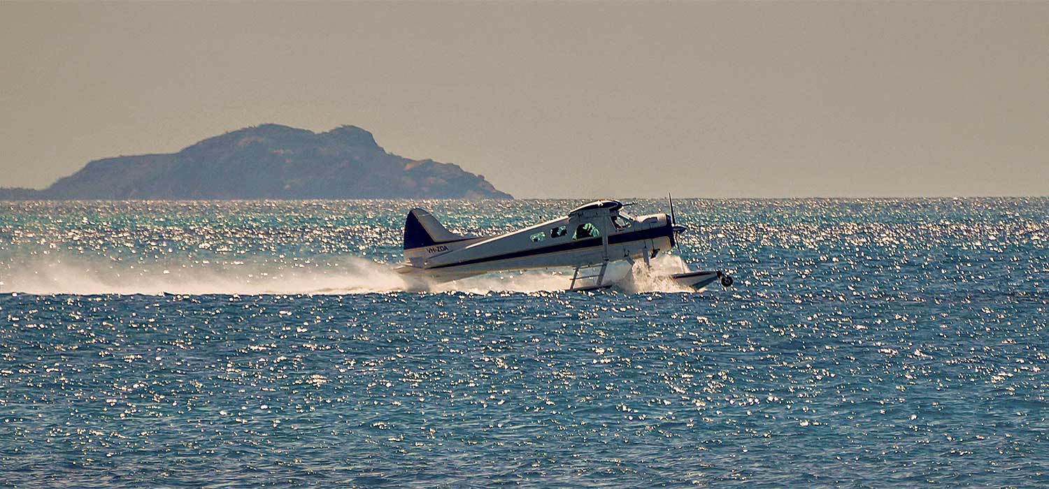 Seaplane taking off at Whitehaven beach