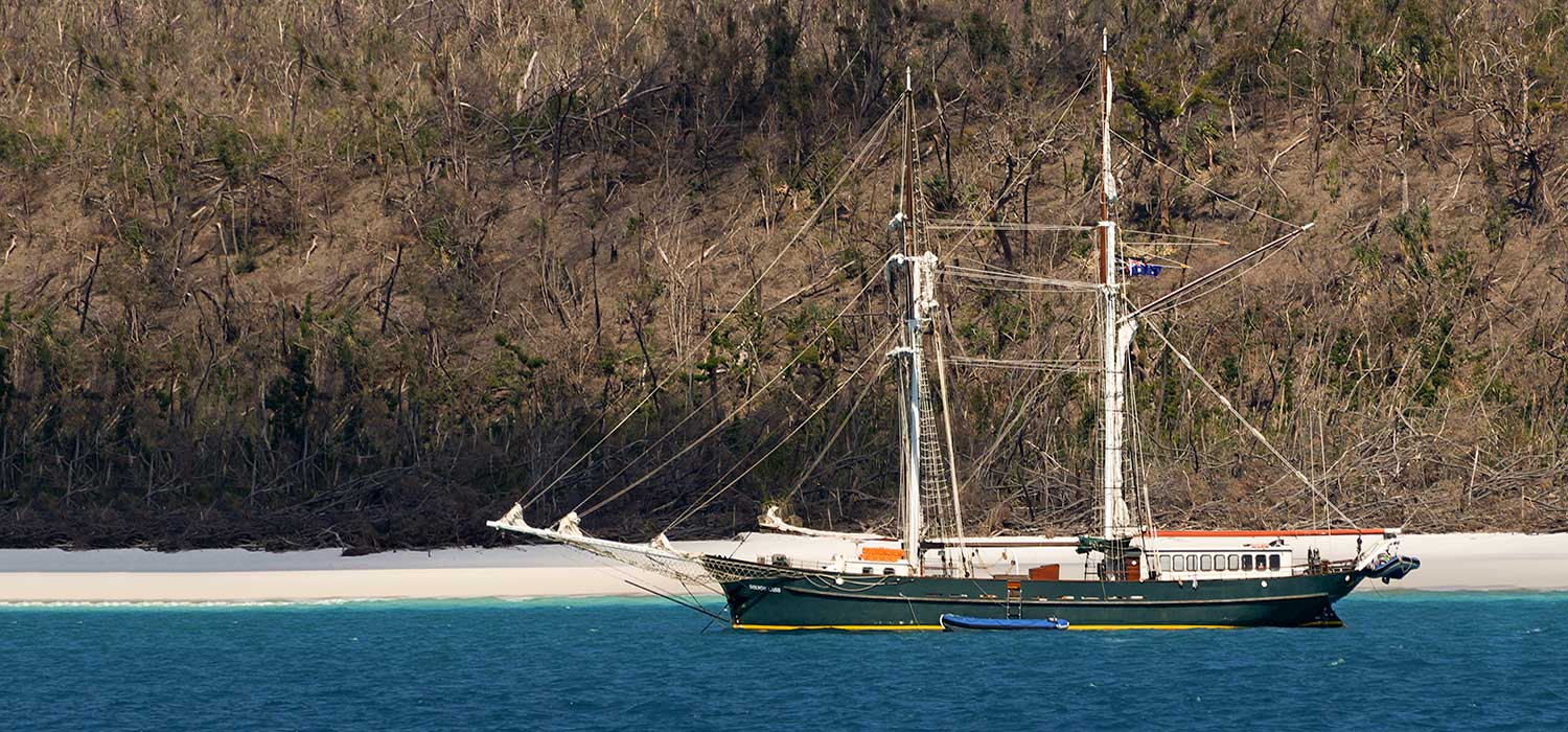 Sailing boat moored at Whitehaven beach 